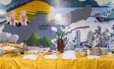 Beautiful cruise buffet table with scenic Halong Bay backdrop, perfect for a relaxing day on the wat.