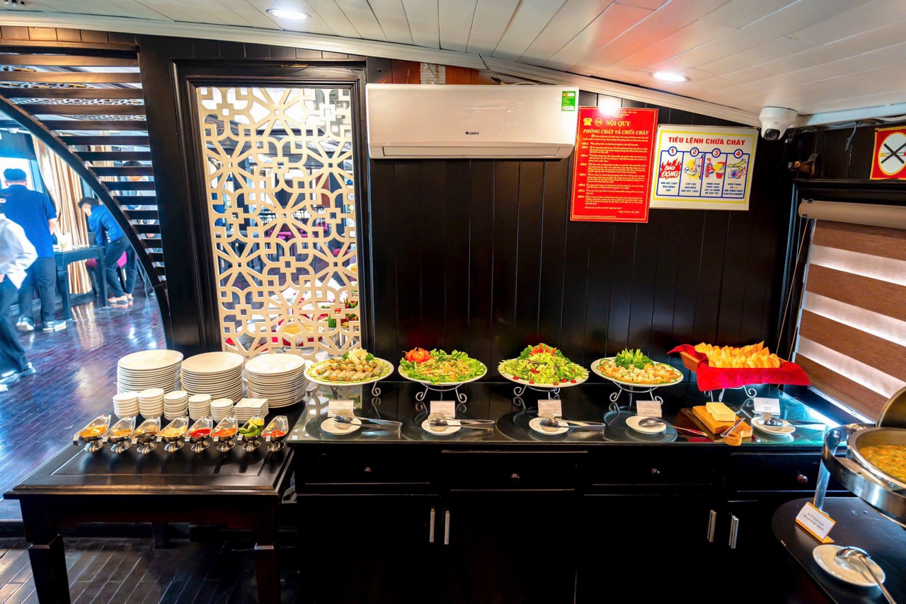 Stunning Halong Bay cruise balcony with scenic views and luxurious dining experience.