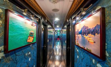 Vivid scene of cruise balcony overlooking Halong Bay with scenic limestone islands, serene waters, a.