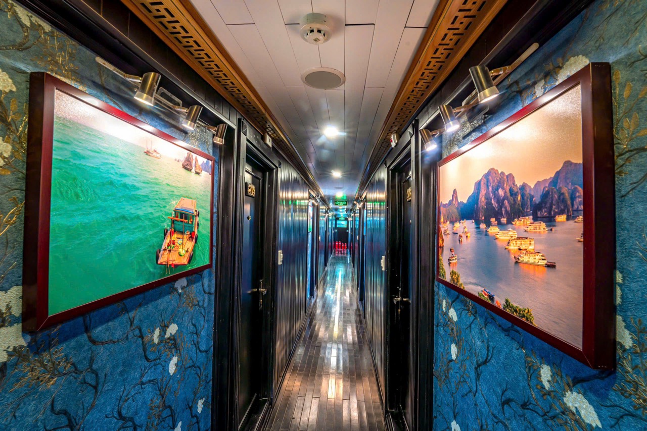 Vivid scene of cruise balcony overlooking Halong Bay with scenic limestone islands, serene waters, a.