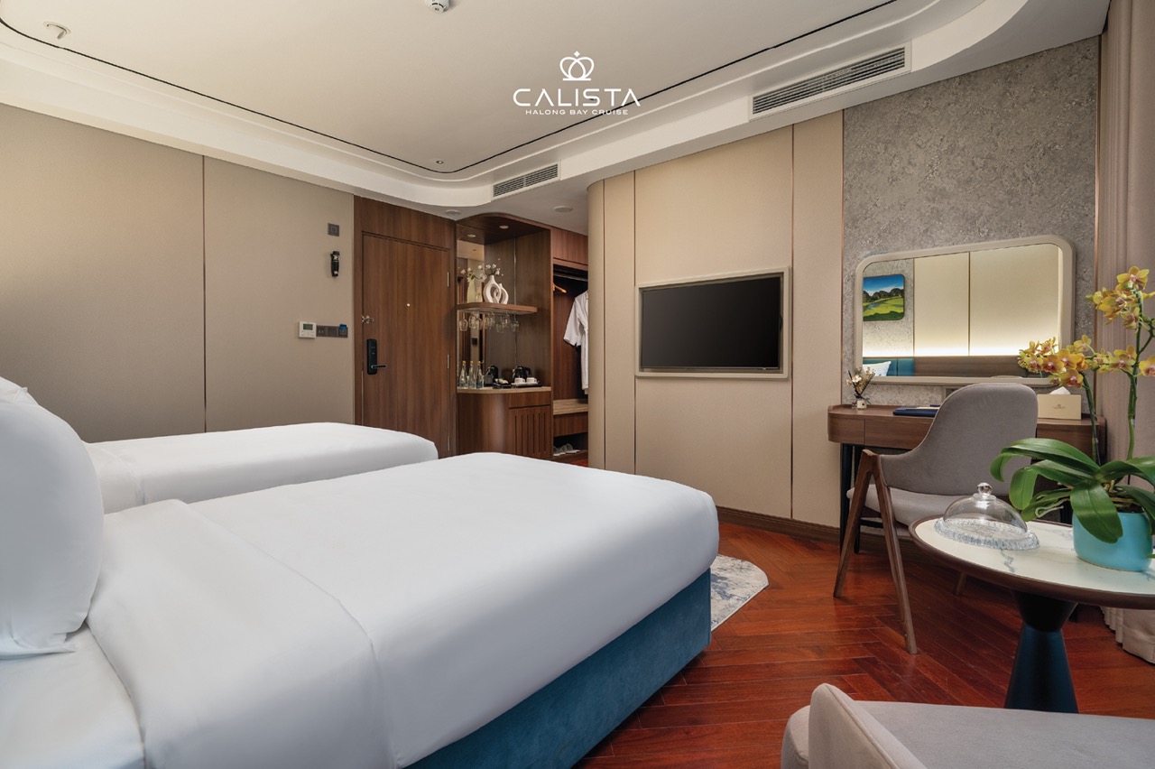 Luxurious cruise cabin with modern decor on Halong Bay, perfect for a relaxing 2D1N voyage.