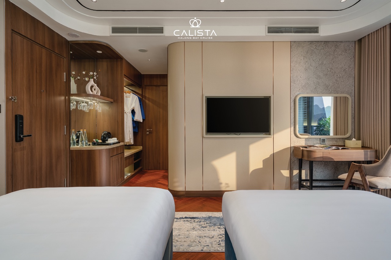 Luxury cruise cabin interior with modern amenities and scenic views.
