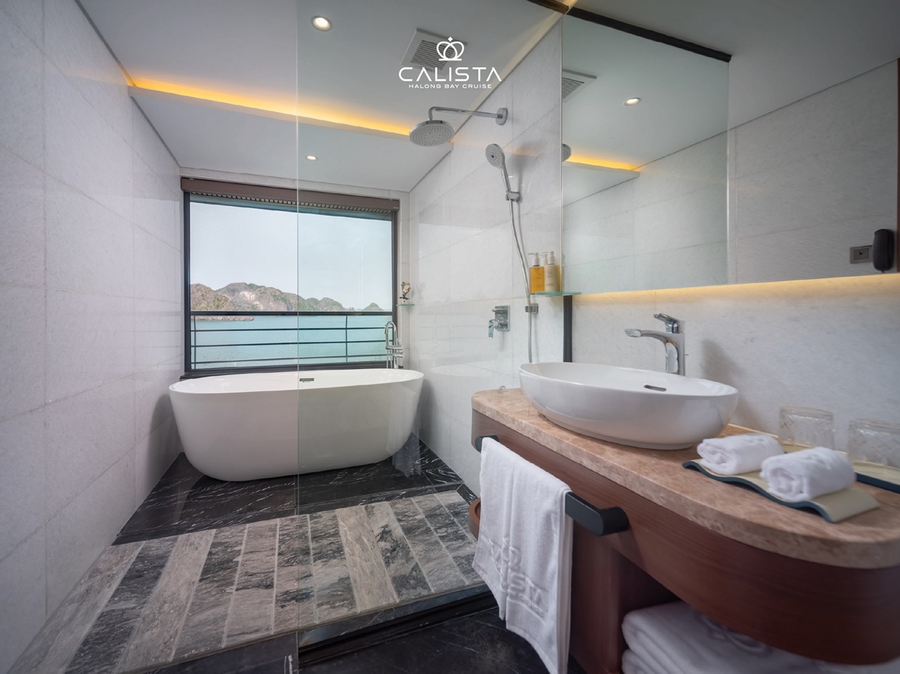 Elegant bathroom with sea view, perfect for a luxurious Halong Bay 2D1N cruise experience.
