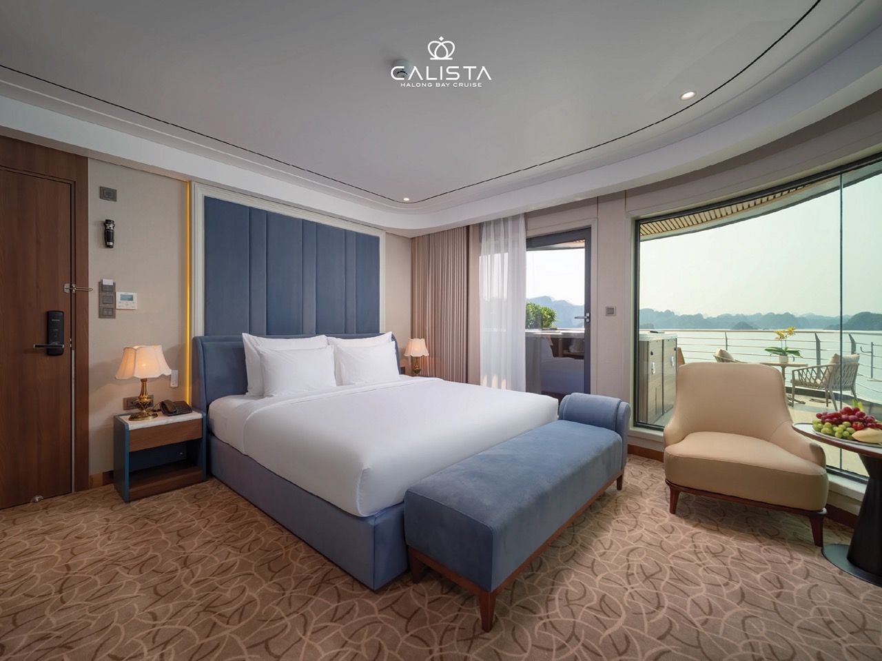Stunning view from a luxurious cruise balcony overlooking Halong Bay, perfect for a relaxing getaway.