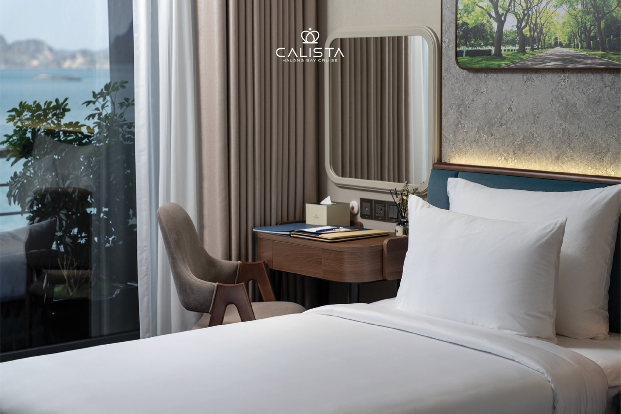 Elegant cruise balcony view of Halong Bay with lush scenery and tranquil waters, perfect for a memor.