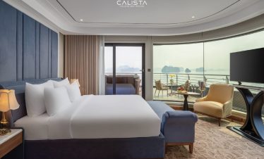 Elegant cruise balcony view of Halong Bay with modern amenities and scenic vistas, perfect for a rom.