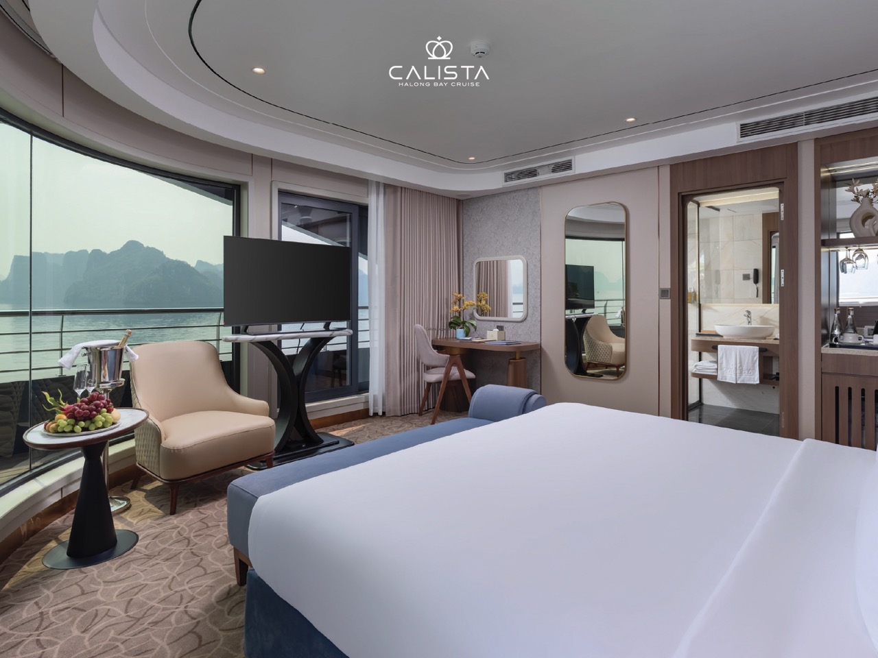 Balcony view of Halong Bay from a luxury cruise, showcasing serene waters and stunning limestone kar.