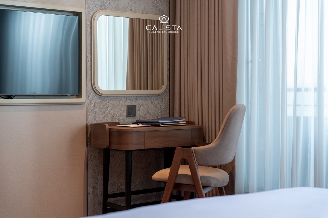 Elegant cruise balcony overlooking Halong Bay's stunning limestone karsts and emerald waters, perfec.