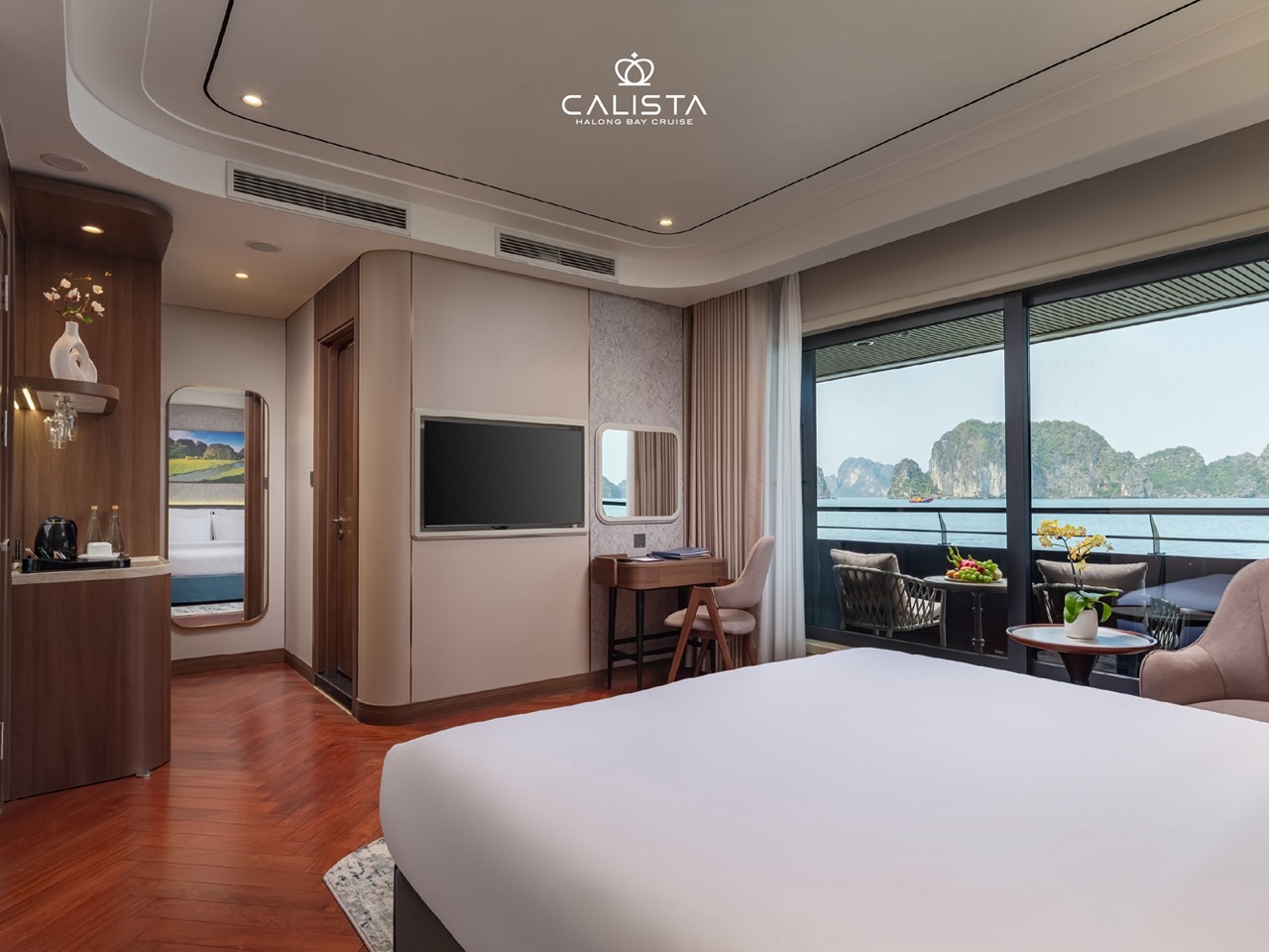 Elegant cruise balcony overlooking Halong Bay's stunning limestone karsts - ViettrendTour.
