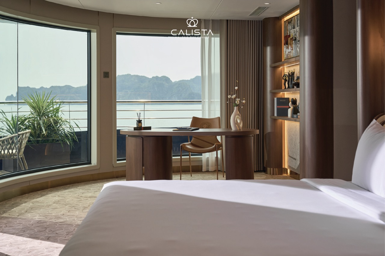 Luxurious cruise balcony view of Halong Bay with modern interior and scenic waterscape.