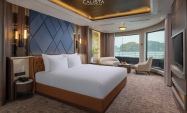 Luxurious cruise balcony with panoramic views of Halong Bay, perfect for a romantic getaway or relax.