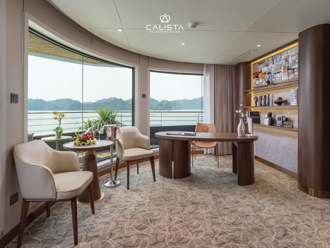 Elegant cruise lounge with panoramic views of Halong Bay, perfect for relaxing and enjoying the scen.