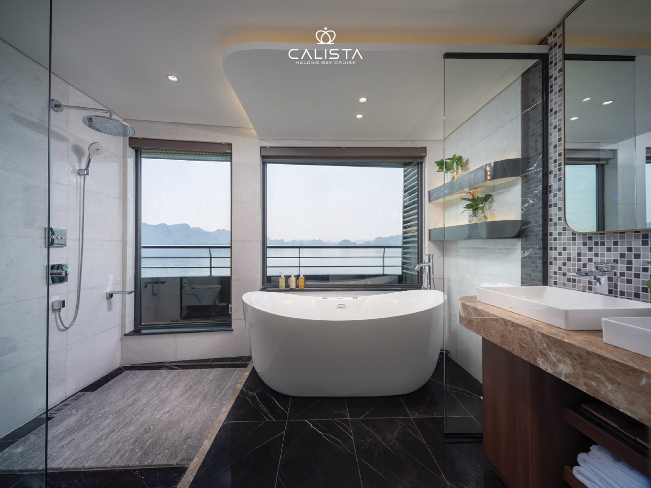 Luxurious cruise bathroom overlooking Halong Bay, perfect for relaxing and enjoying stunning seascap.