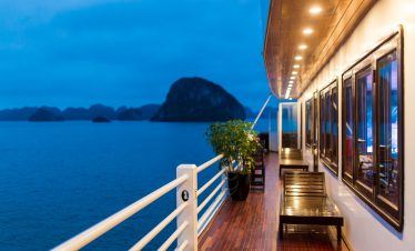 Stunning Halong Bay cruise balcony scene showcasing limestone islands and tranquil waters, perfect f.