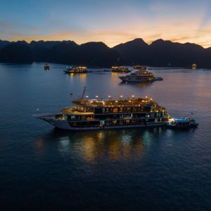 Luxurious cruise ships in Halong Bay at sunset, Vietnam travel and Tours, scenic boat tour.