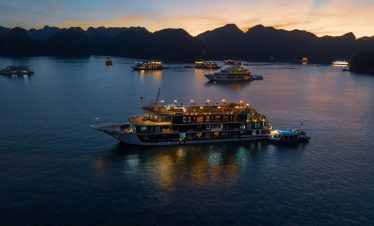 Luxurious cruise ships in Halong Bay at sunset, Vietnam travel and Tours, scenic boat tour.