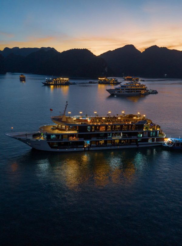 Luxurious cruise ships in Halong Bay at sunset, Vietnam travel and Tours, scenic boat tour.
