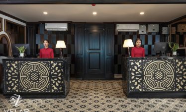 Reception area with elegant decor and friendly staff on Velar of The Sea Cruise in Halong Bay.