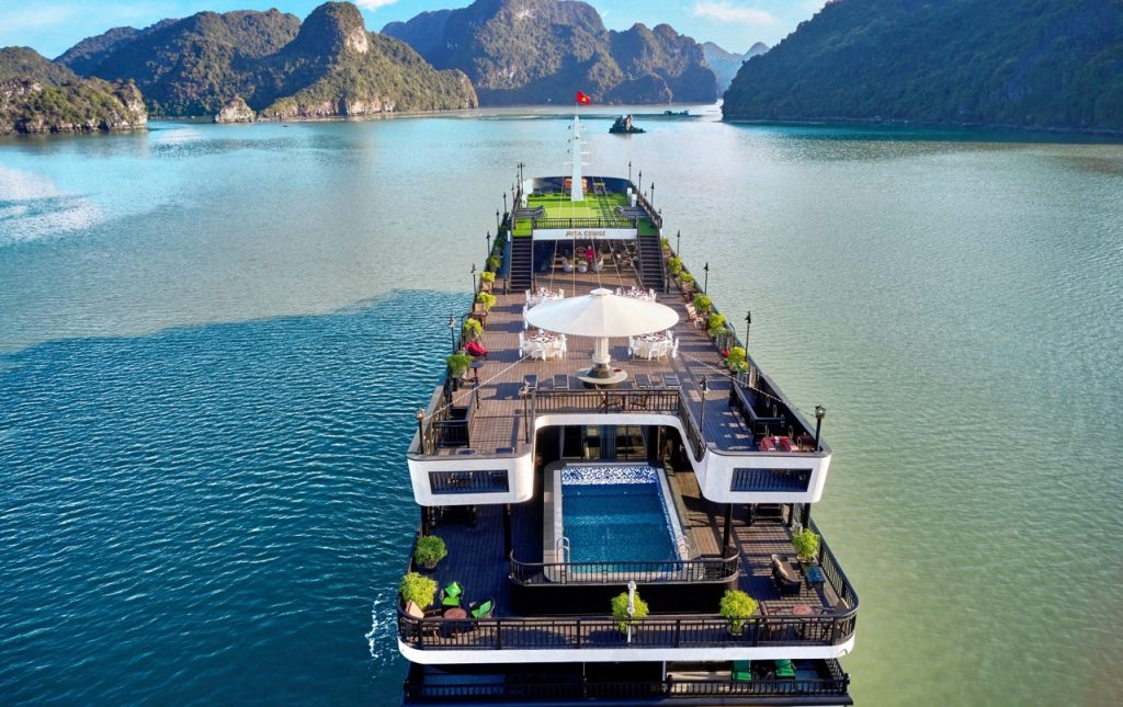 Stunning Halong Bay cruise ship with scenic limestone islands and calm waters.