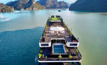 Stunning Halong Bay cruise ship with scenic limestone islands and calm waters.