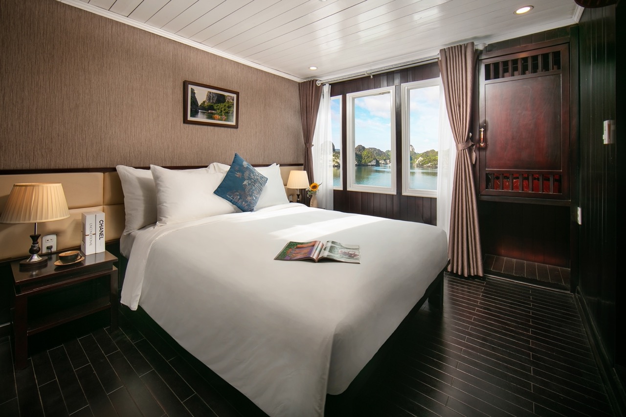 Stunning cruise balcony view in Halong Bay with elegant interior and panoramic scenery.