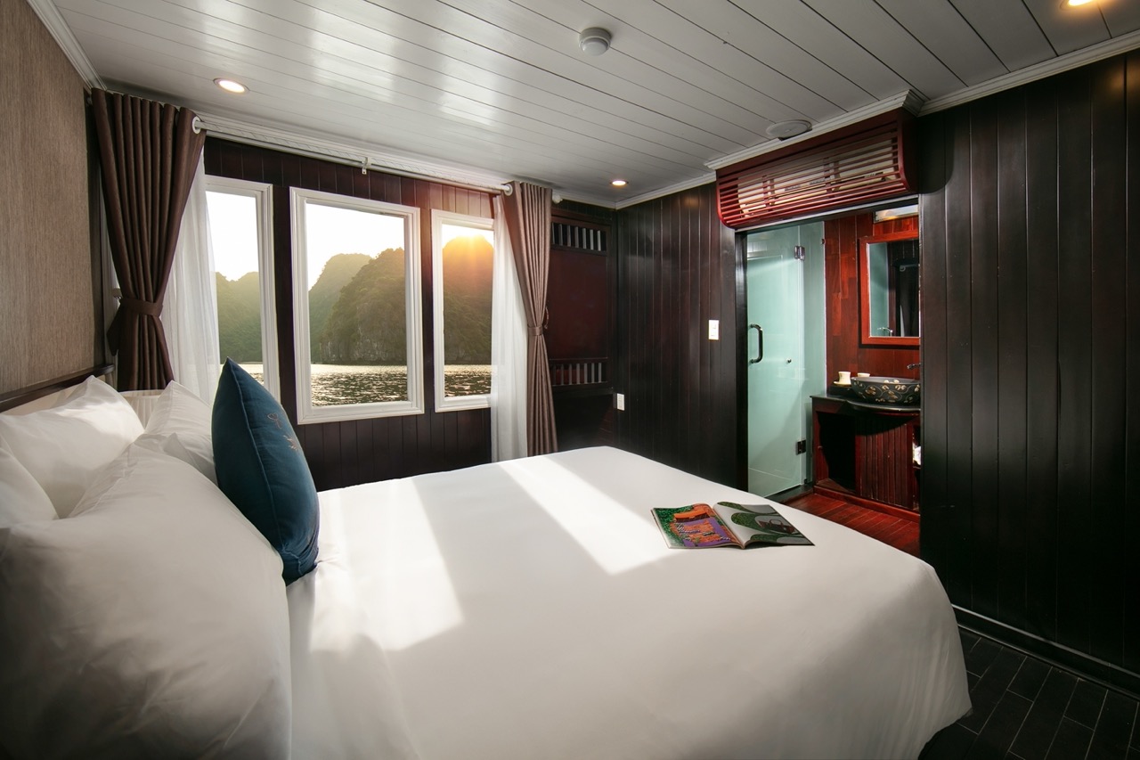 Stunning view from cruise balcony in Halong Bay, perfect for relaxing and enjoying the scenic beauty.
