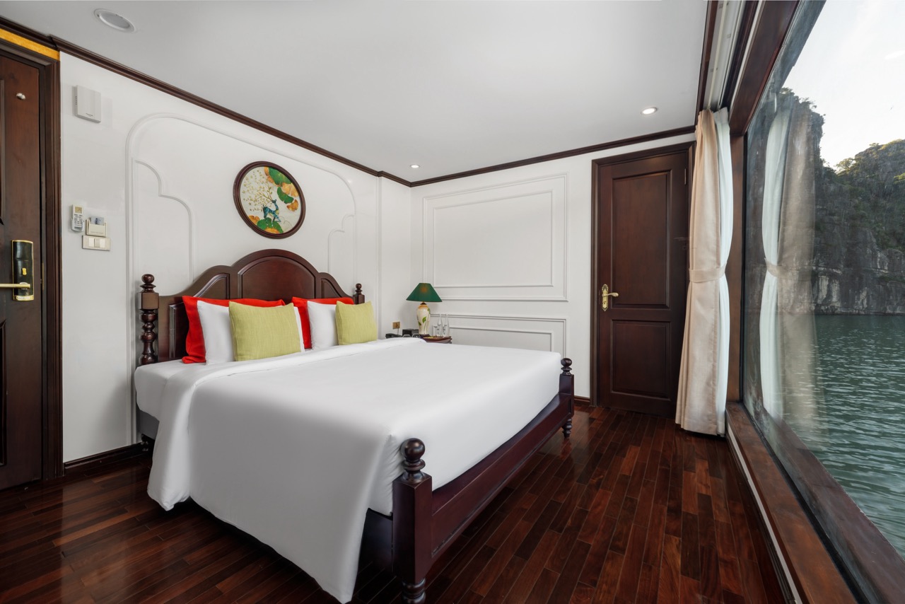 Luxurious cruise balcony room with scenic views of Bai Tu Long Bay, perfect for a relaxing getaway.