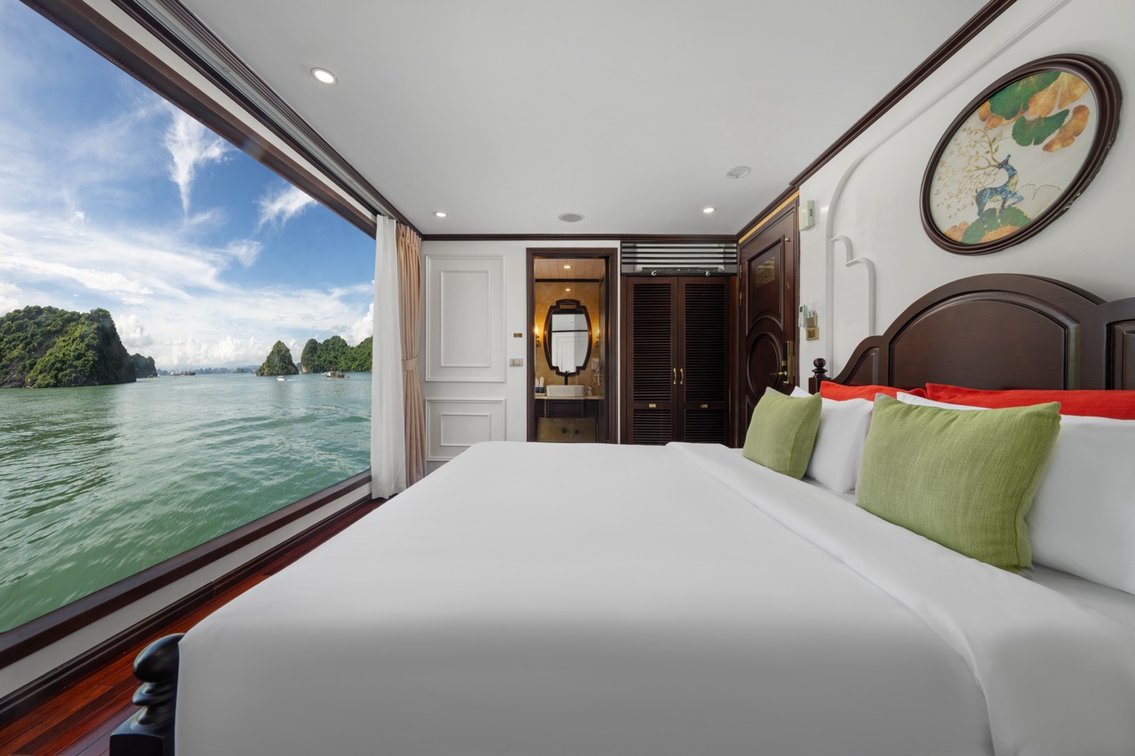 Ocean view cabin on Bai Tu Long Cruise showcasing stunning scenery and modern comfort.