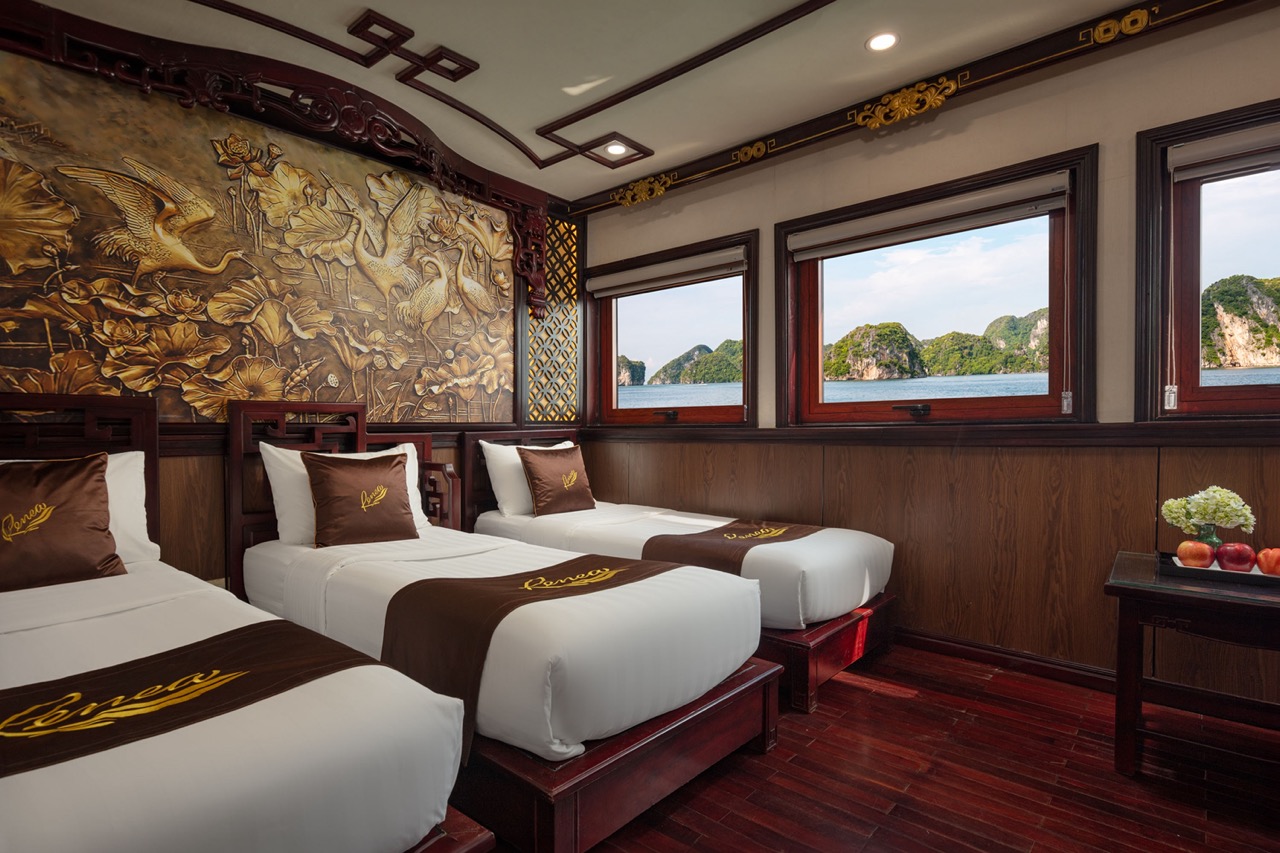 Luxurious cruise balcony overlooking Halong Bay with stunning views and elegant interiors.