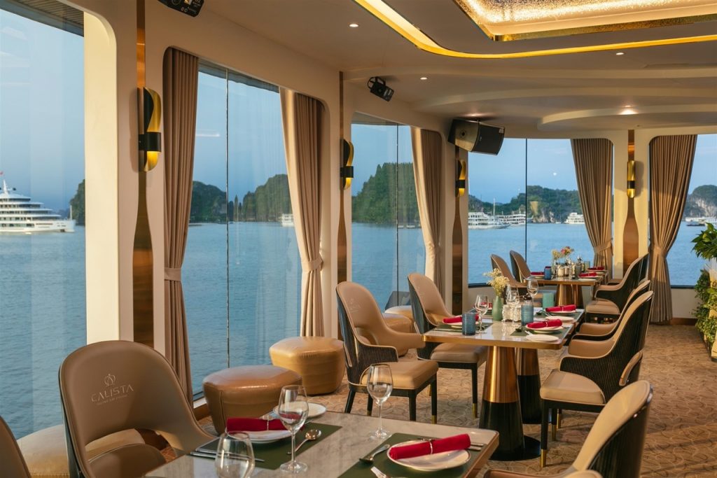 Relaxing cruise lounge with panoramic views of Halong Bay, elegant interior, perfect for a luxurious.