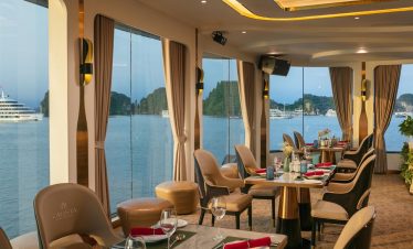 Relaxing cruise lounge with panoramic views of Halong Bay, elegant interior, perfect for a luxurious.