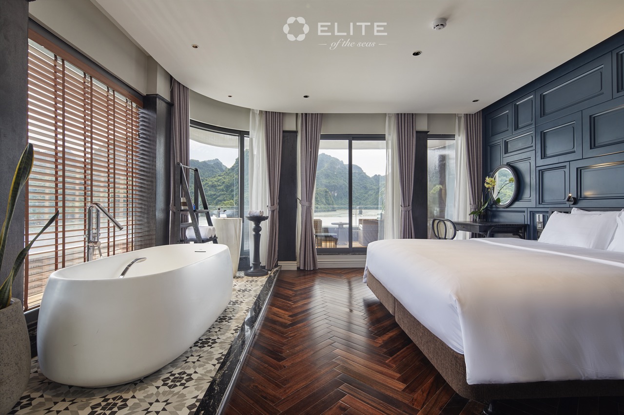 Elegant cruise balcony view of Halong Bay with spacious room and modern amenities.
