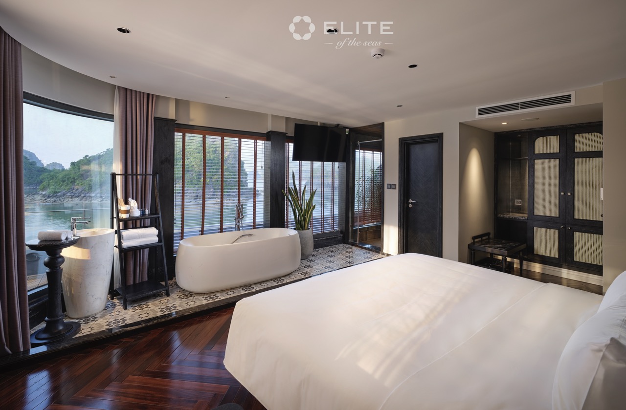 Stunning view of Halong Bay from a luxurious cruise balcony, perfect for relaxing and enjoying the s.