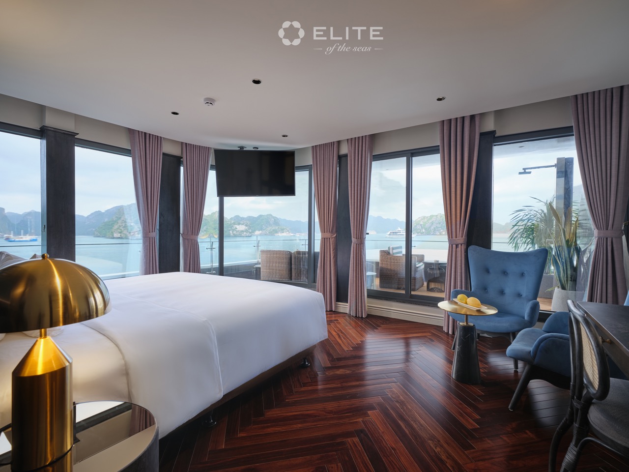 Panoramic view of Halong Bay from a luxurious cruise balcony suite, perfect for a memorable travel e.