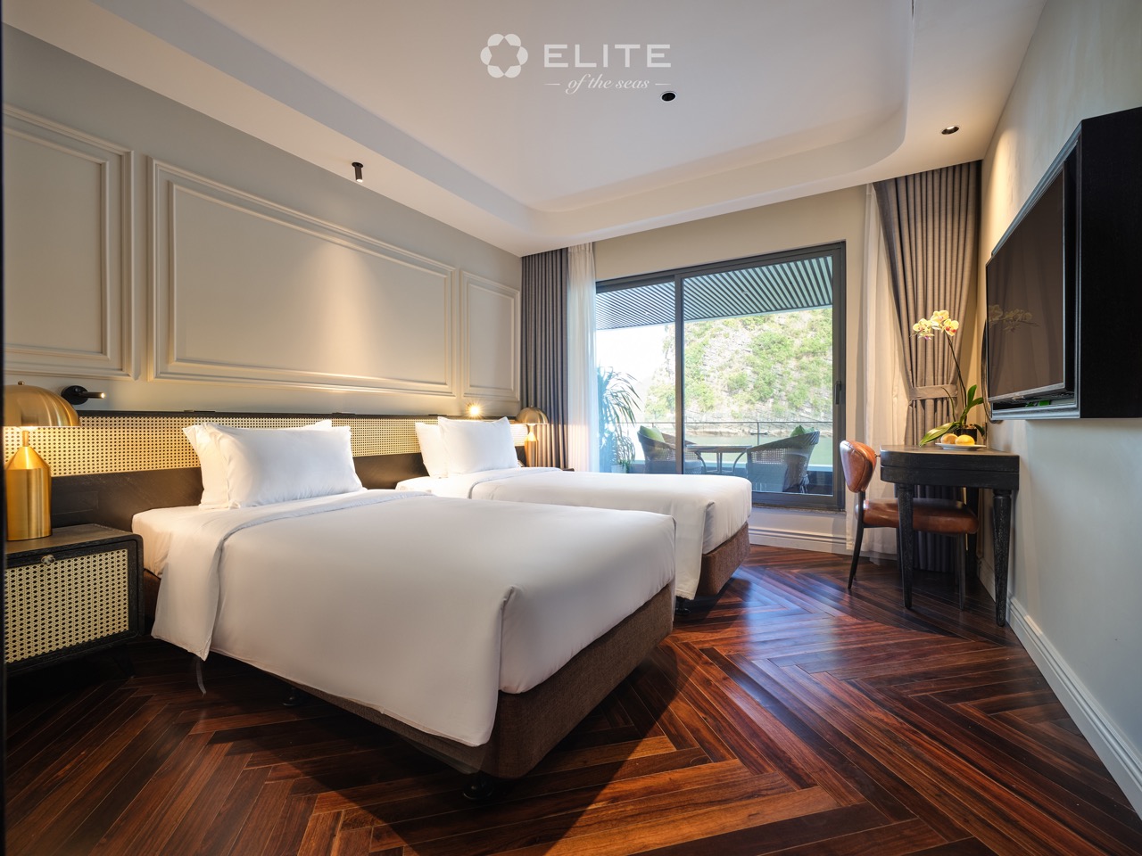 Halong Bay cruise balcony with elegant interior and scenic view.
