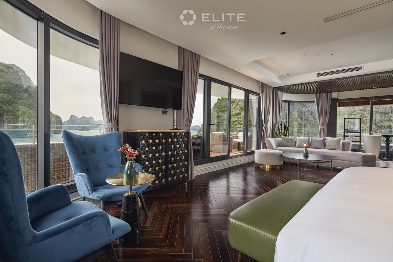 Spacious cruise balcony with modern decor and panoramic views of Halong Bay, perfect for a relaxing.