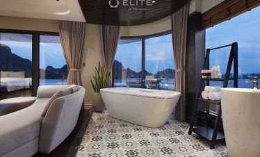 Elegant scene of a luxurious bathroom with a stunning view of Halong Bay from the cruise balcony, pe.