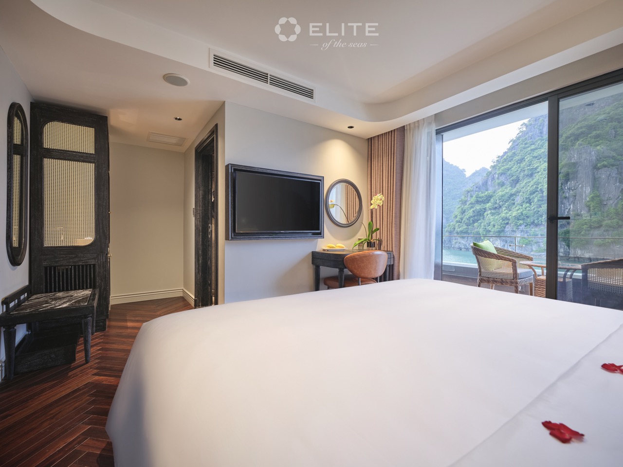 Stunning view from the cruise balcony overlooking lush green islands in Halong Bay, perfect for a lu.