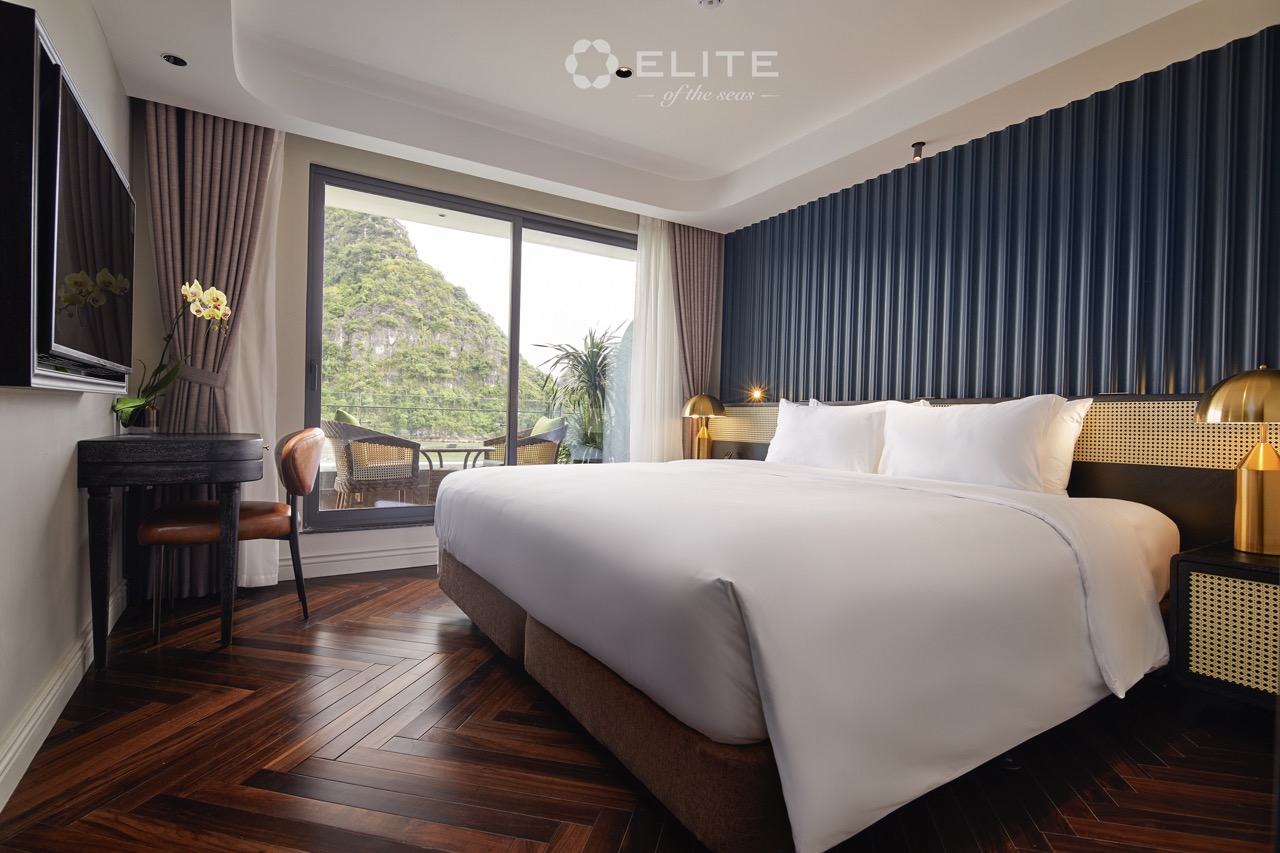 Luxurious cruise room with panoramic views of Halong Bay, perfect for a relaxing and scenic getaway.