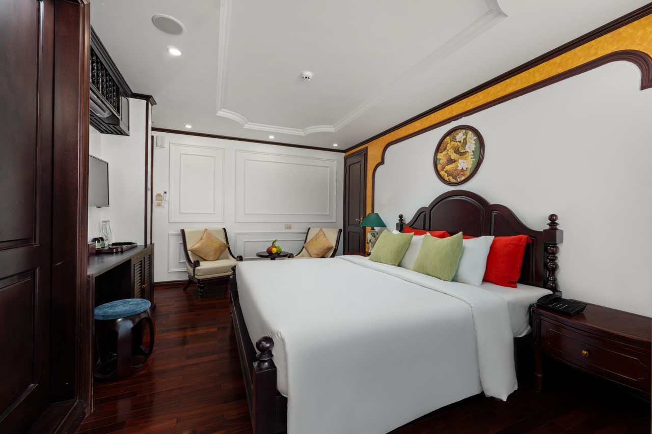Elegant cruise balcony with comfortable bedding and scenic views in Bai Tu Long Bay.