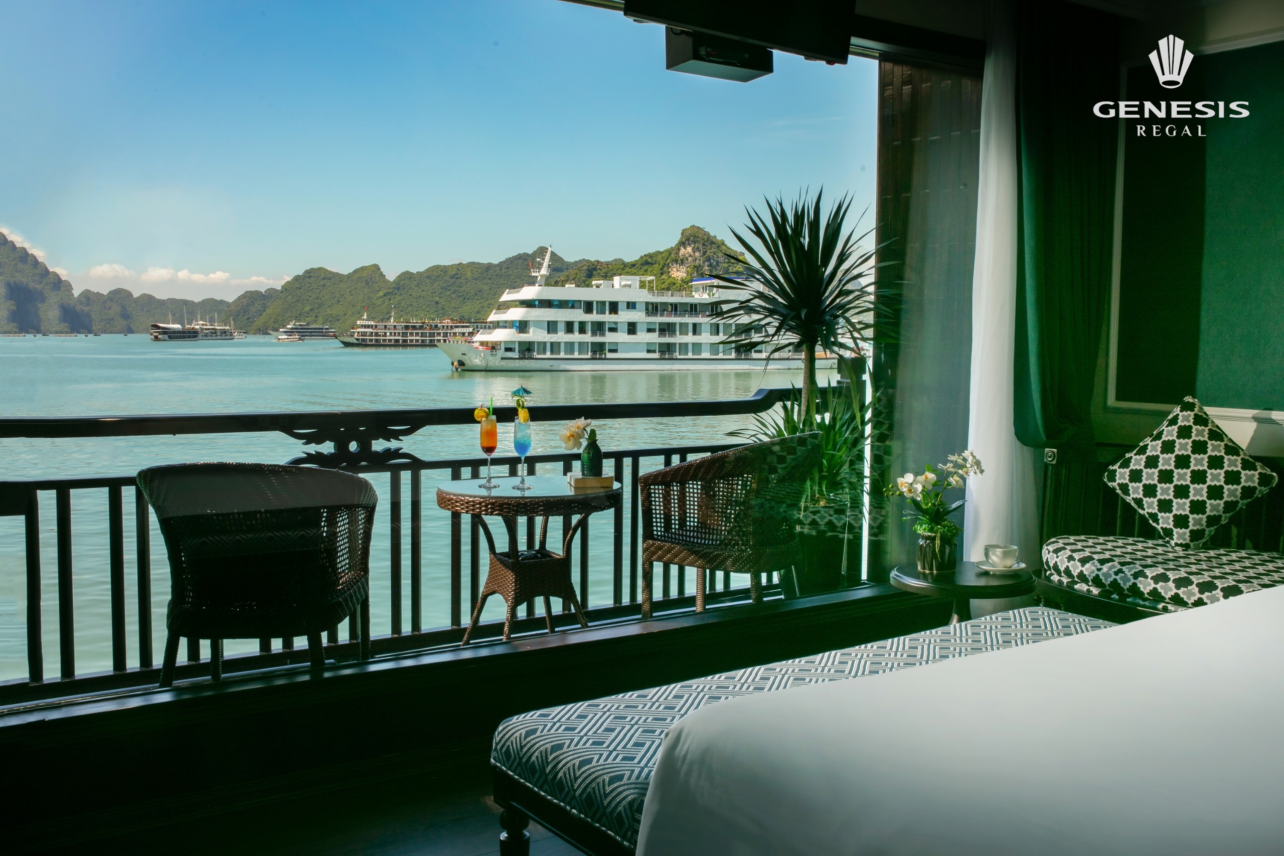 Stunning view from cruise balcony overlooking Halong Bay with emerald waters and limestone islands,.