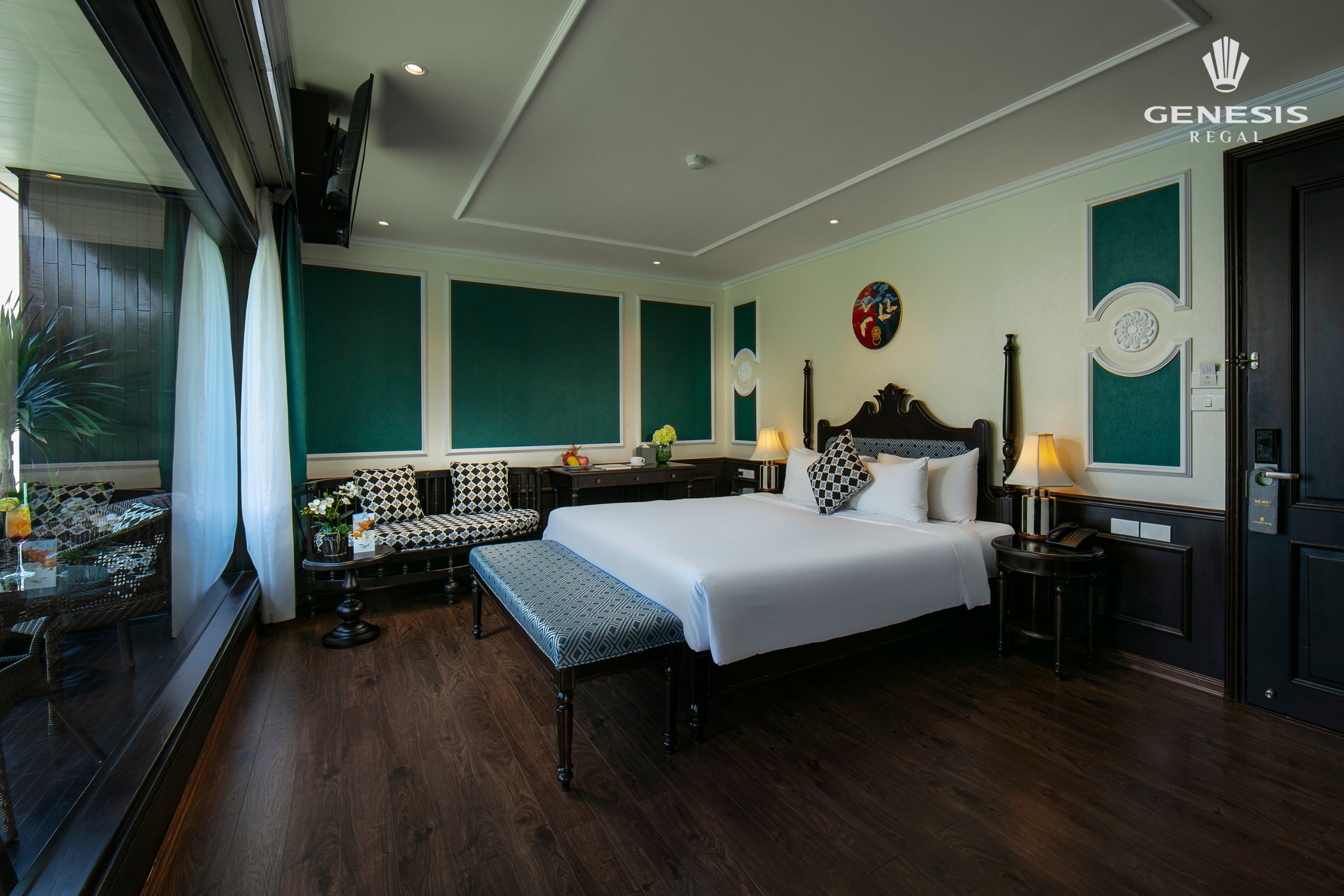 Elegant cruise cabin with modern decor and scenic balcony views in Halong Bay. Perfect for a romanti.