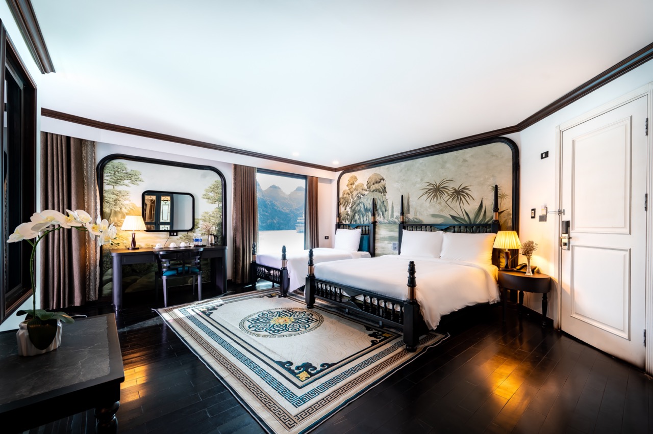 Elegant cruise balcony view of Halong Bay with serene waters and limestone karsts. Perfect for a rom.