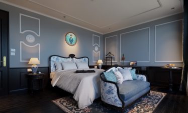 Elegant cruise room with plush bedding and stylish decor, perfect for a relaxing Lan Ha Bay getaway.