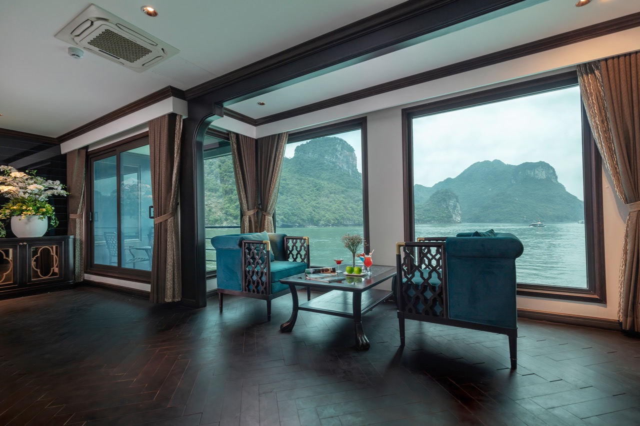 Elegant cruise balcony overlooking Halong Bay's stunning limestone karsts, perfect for a relaxing ge.