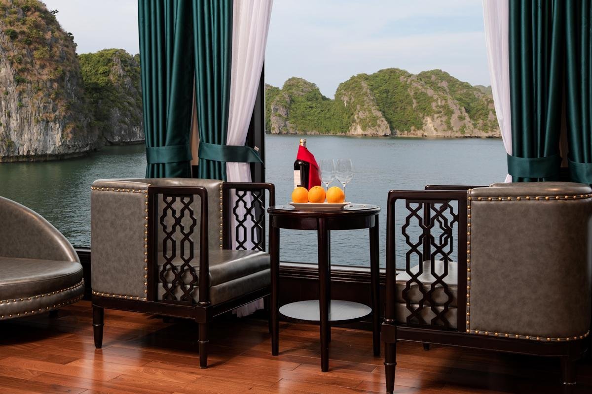 Luxury waterfront lounge with scenic island views, cozy seating, and elegant decor for relaxing moments.