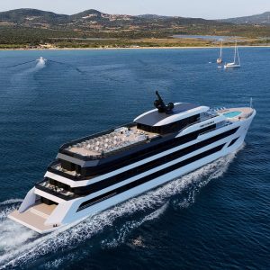 Luxurious yacht cruising in pristine blue waters with scenic coastline background.