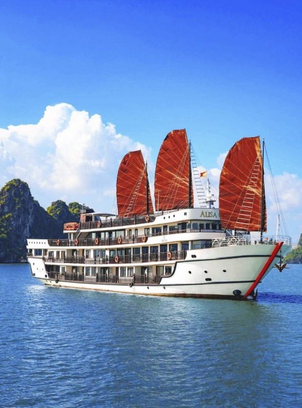 Beautiful Halong Bay cruise with traditional sails, scenic limestone islands, and tranquil waters.