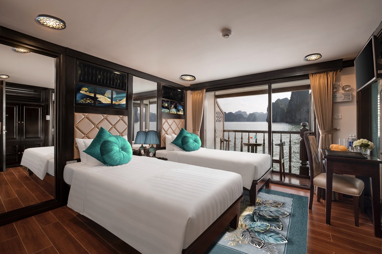 Balcony view of Halong Bay from a luxury cruise room, perfect for a relaxing getaway in Vietnam’s st.