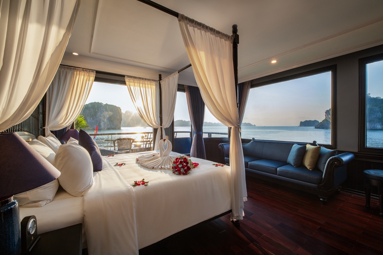Elegant cruise balcony view of Halong Bay with serene waters and limestone islands. Perfect for a ro.